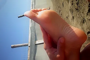 Lovely Amateur Girl Massages Her Amazing Naked Feet And Soles On The Beach - porn video
