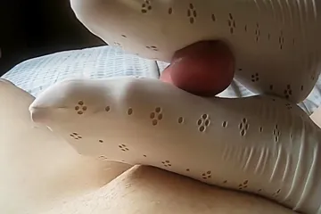 Hottie With Socks On Her Delicious Feet Giving A Super Sexy Footjob In Bed - porn video