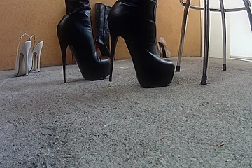 Girl In Sexy Black Boots Crushing Some Tiny Rocks On The Floor - porn video