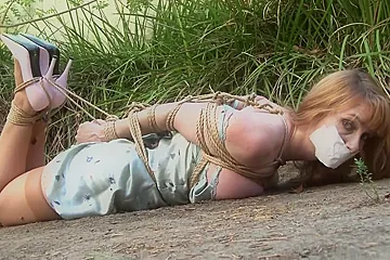 Kristine Tied Tight And Gagged In The Yard - porn video