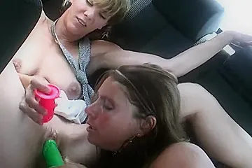 Two Horny German Chicks Pleasing Each Other In The Back Of A Car P2 - porn video