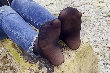 Feet In Black And Grey Nylon Socks Wiggling Toes At The Seashore - porn video