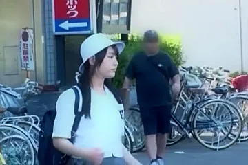 A man targets a girl in a uniform, groping her body and lifting her skirt to touch her buttocks. - porn video